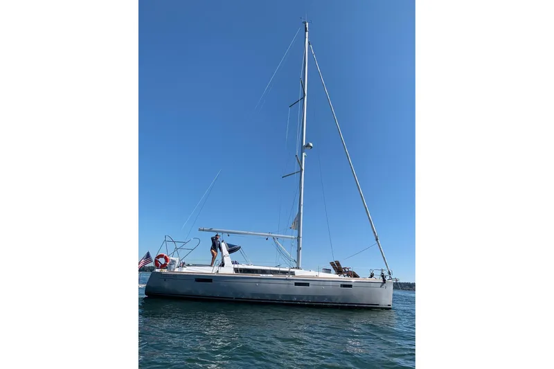 Slide: The Image of 2018 Beneteau Oceanis 45 sailboat on calm water under clear blue sky. - 4