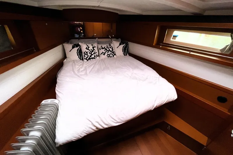 Slide: The Image of Cozy cabin interior of 2018 Beneteau Oceanis 45 yacht with bed and window. - 41