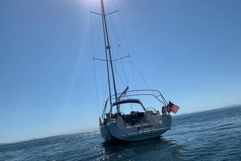 Slide: The Image of 2018 Beneteau Oceanis 45 sailboat on calm sea under clear blue sky. - 5