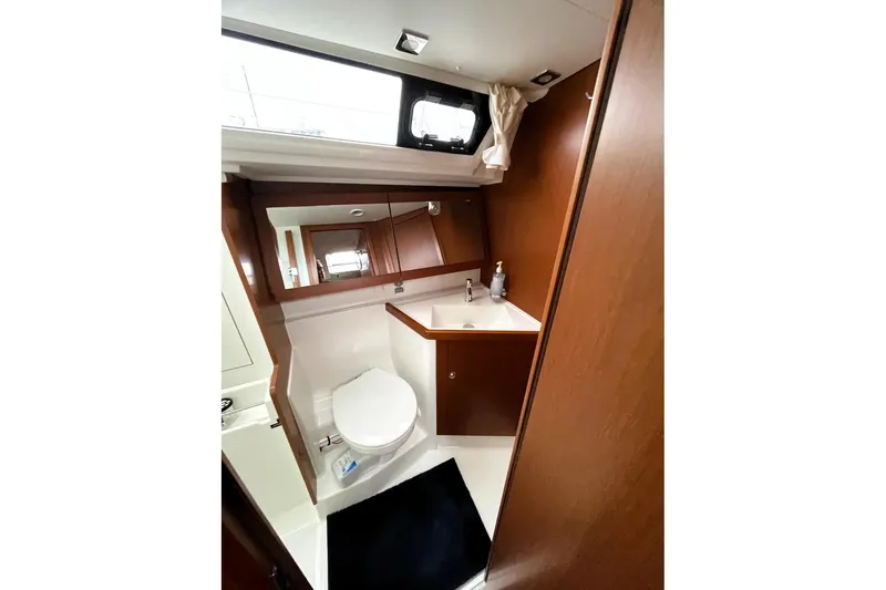 Slide: The Image of Bathroom interior of 2018 Beneteau Oceanis 45 yacht, featuring modern fixtures and wood accents. - 50