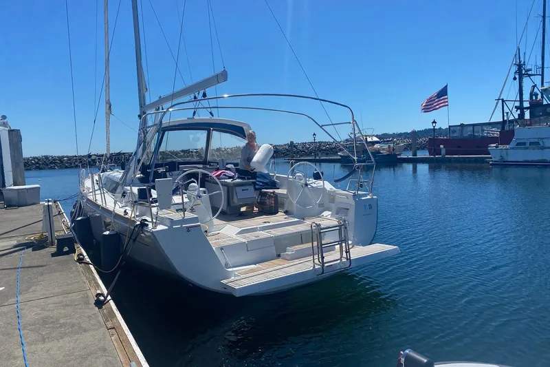 Slide: The Image of 2018 Beneteau Oceanis 45 yacht docked at marina under clear blue sky. - 9