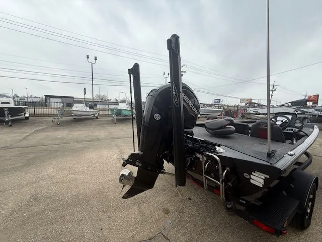 Slide: The Image of 2023 Ranger RT178 boat with outboard motor in parking lot. - 30