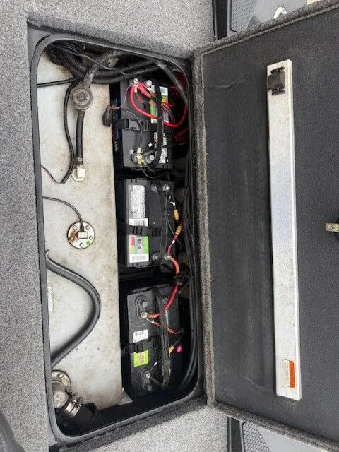 Slide: The Image of Battery compartment of 2023 Ranger RT178 boat with three batteries. - 7