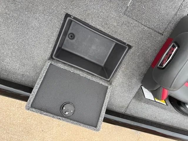 Slide: The Image of Open storage compartment in 2023 Ranger RT178 boat. - 9
