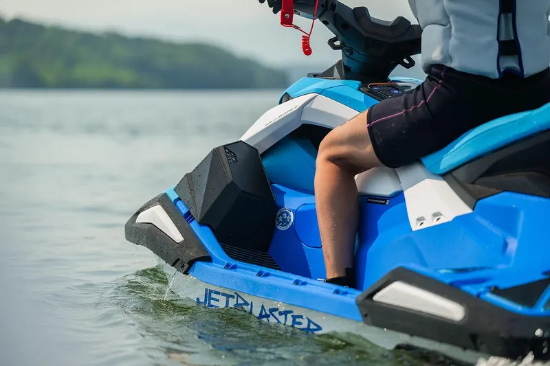 Slide: The Image of Manufacturer Provided Image: 2026 Yamaha WaveRunner JetBlaster DLX 3-Up on water, showcasing sleek blue design. - 4