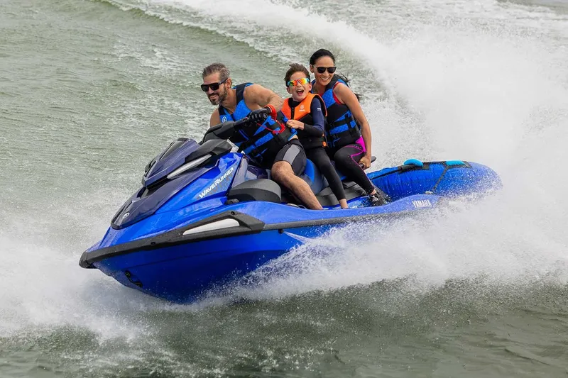 Slide: The Image of Manufacturer Provided Image: 2026 Yamaha WaveRunner VX Limited HO with three riders enjoying a thrilling water ride. - 3