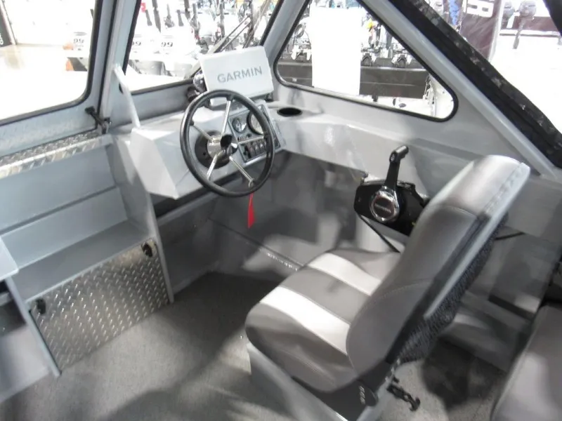 Slide: The Image of Interior of 2026 Hewescraft 180 Sportsman with Garmin controls. - 12