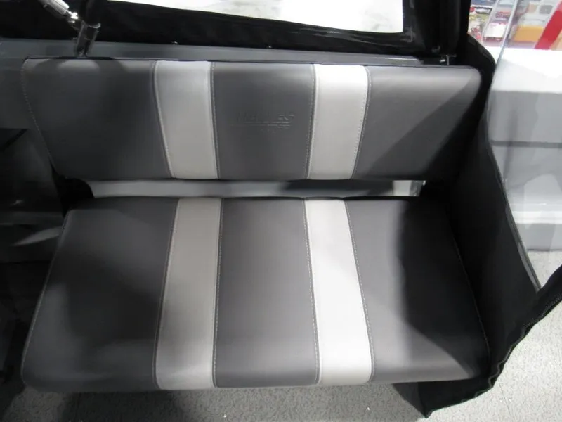 Slide: The Image of Seat in Hewescraft 180 Sportsman 2026, gray and white design. - 15