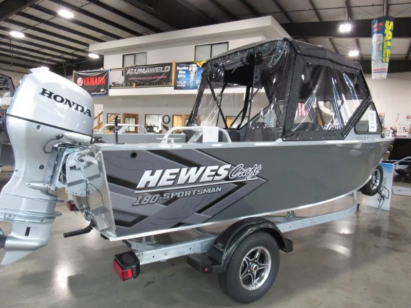 Slide: The Image of 2026 Hewescraft 180 Sportsman boat with Honda outboard motor. - 5