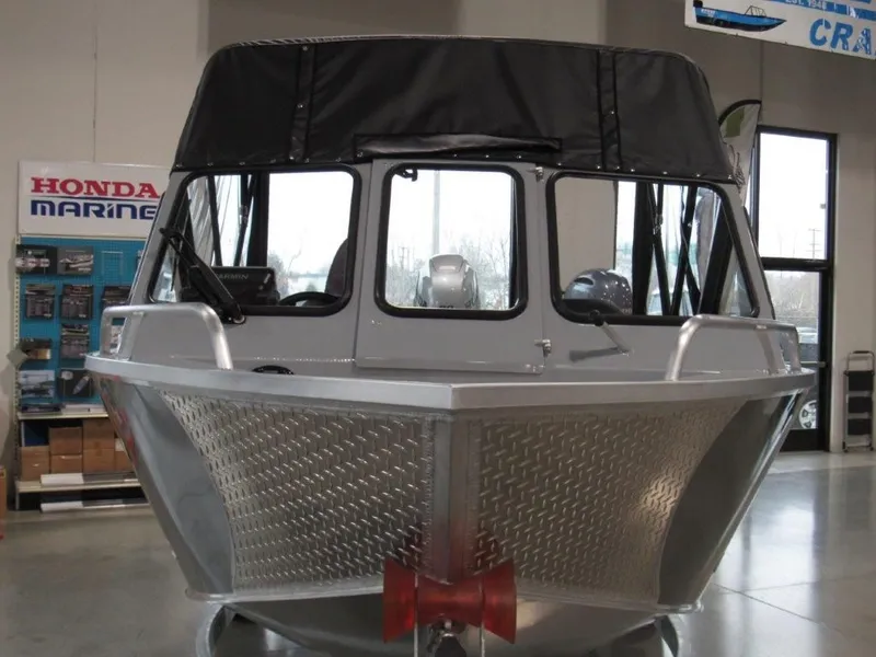 Slide: The Image of 2026 Hewescraft 180 Sportsman boat in a showroom. - 8