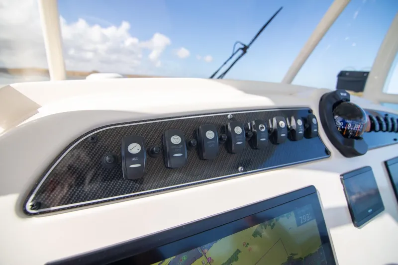 Slide: The Image of Control panel of 2023 Grady-White Canyon 326 boat with navigation instruments. - 17