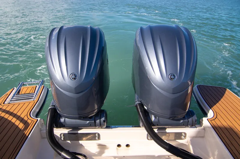 Slide: The Image of 2023 Grady-White Canyon 326 boat with dual Yamaha outboard engines on water. - 24