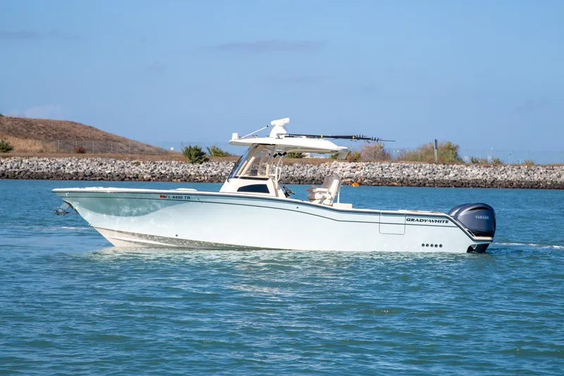 Slide: The Image of 2023 Grady-White Canyon 326 boat cruising on a sunny day. - 3