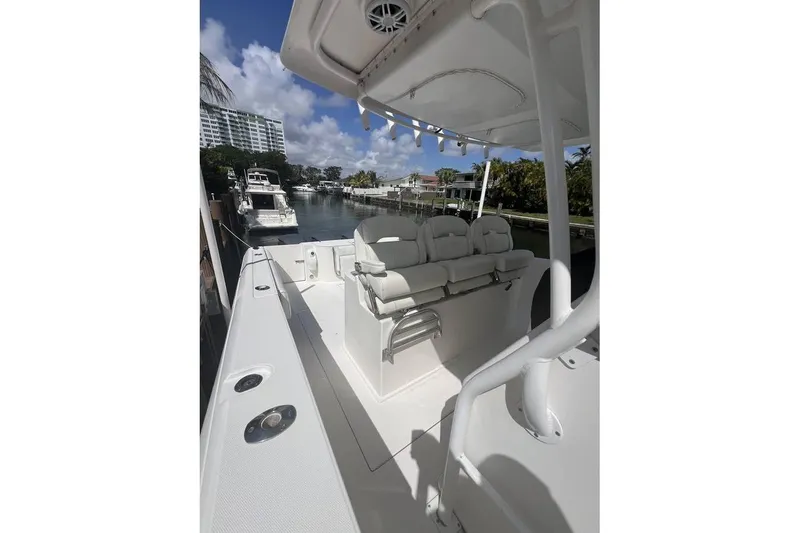 Slide: The Image of 2014 Stamas 390 Tarpon boat docked, featuring spacious seating and sleek design. - 3