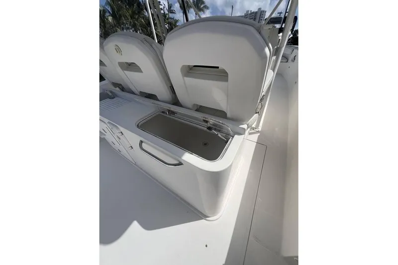 Slide: The Image of 2014 Stamas 390 Tarpon boat interior with seating and storage compartment. - 5