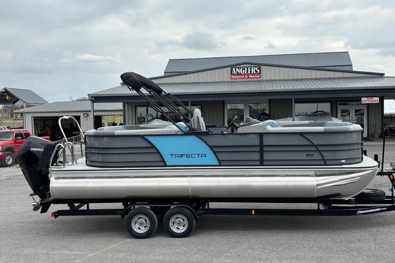 The Image of 2026 Trifecta C Series 24RFC CS pontoon boat on trailer at Anglers Outpost & Marine. - 1