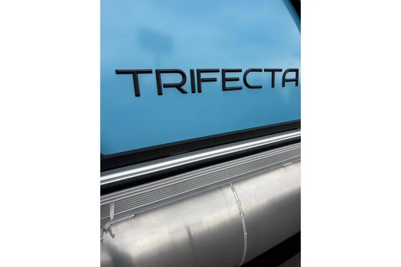 Slide: The Image of Trifecta C Series 24RFC CS 2026 model, sleek blue design with metallic accents. - 14