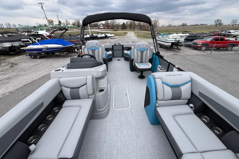 Slide: The Image of 2026 Trifecta C Series 24RFC CS pontoon boat with spacious seating and modern design. - 6