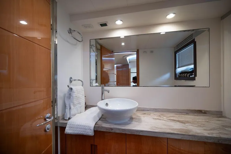 Slide: The Image of Luxurious bathroom interior of 2007 Pershing 62' yacht with modern sink and large mirror. - 10