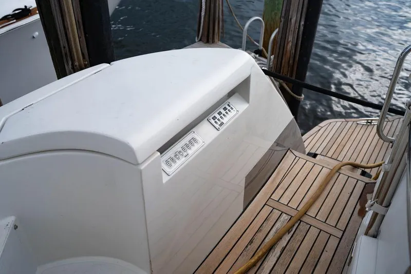 Slide: The Image of 2007 Pershing 62' yacht deck with control panel and wooden flooring. - 14