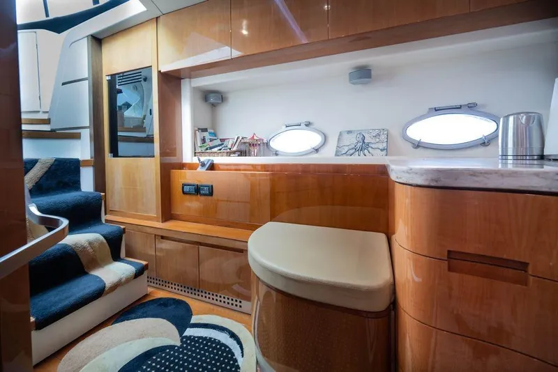 Slide: The Image of Luxurious interior of 2007 Pershing 62' yacht with elegant wood finishes and modern design. - 16