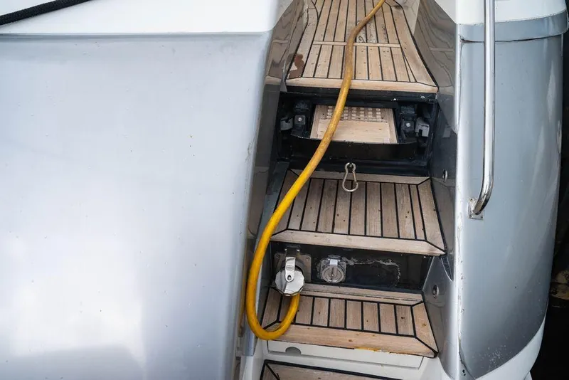 Slide: The Image of Steps on a 2007 Pershing 62' yacht with a yellow cable. - 26