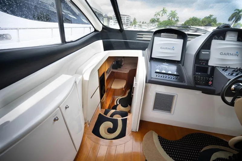 Slide: The Image of Interior of 2007 Pershing 62' yacht with Garmin navigation system and stylish cabin entrance. - 35