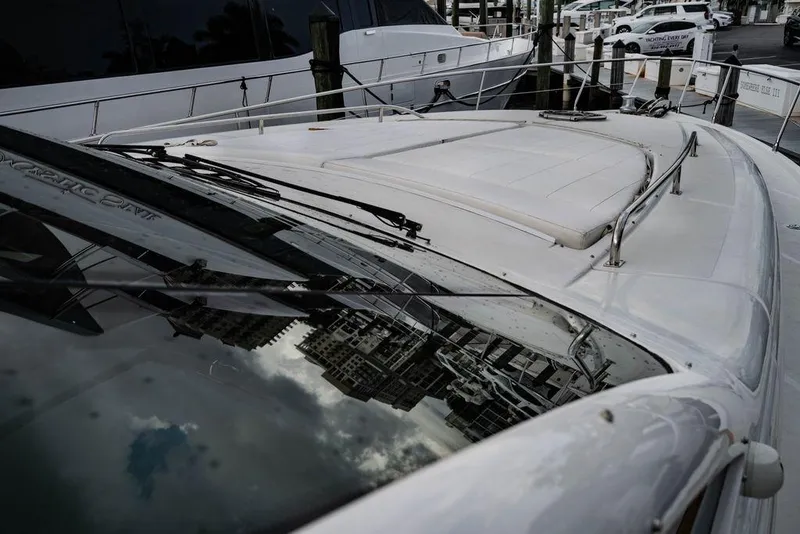 Slide: The Image of 2007 Pershing 62' yacht deck with cityscape reflection on windshield. - 36