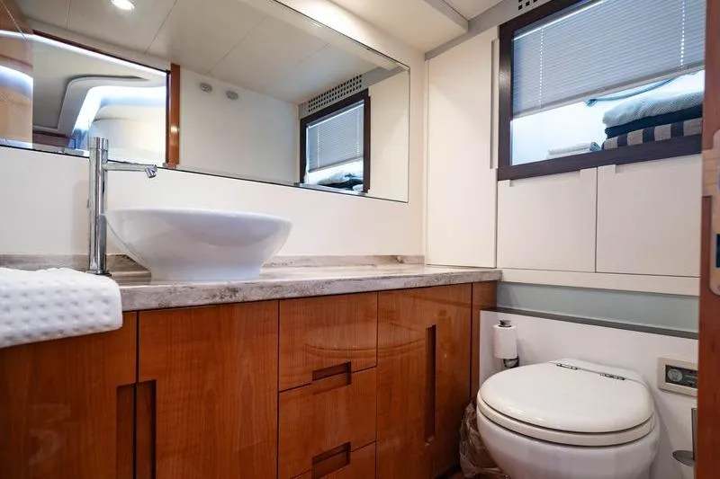 Slide: The Image of Luxurious bathroom interior of 2007 Pershing 62' yacht with modern fixtures and wooden cabinetry. - 6