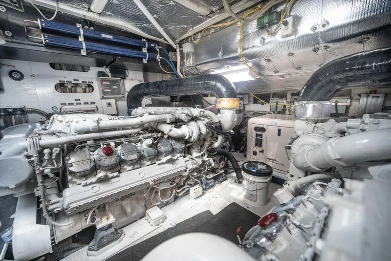 Slide: The Image of Engine room of a 2007 Pershing 62' yacht, showcasing machinery and equipment. - 8