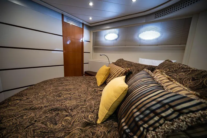 Slide: The Image of Luxurious bedroom interior of 2007 Pershing 62' yacht with elegant bedding and modern design. - 9