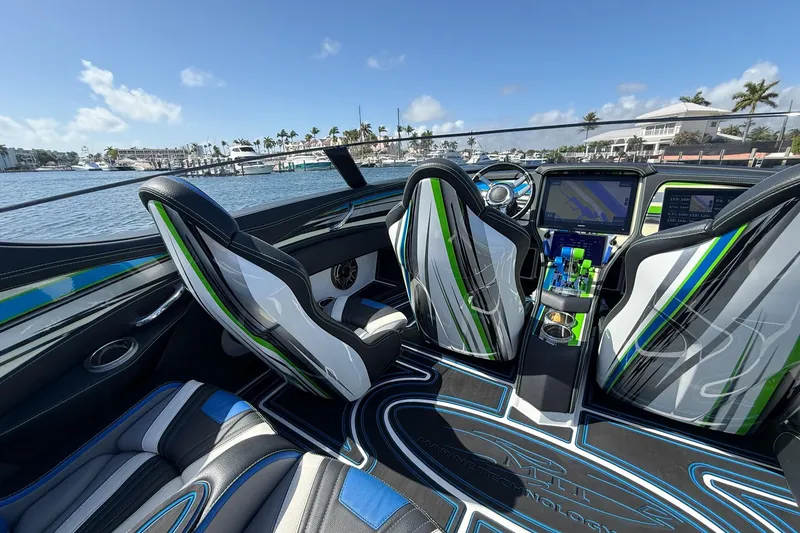 Slide: The Image of Interior of 2022 MTI 390X boat with modern dashboard and stylish seating. - 12