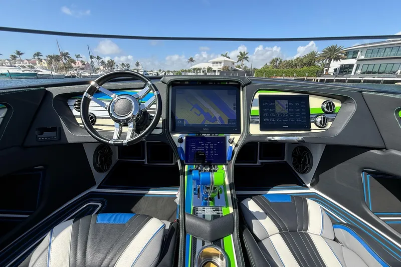 Slide: The Image of Interior of a 2022 MTI 390X boat with advanced navigation system and sleek design. - 13