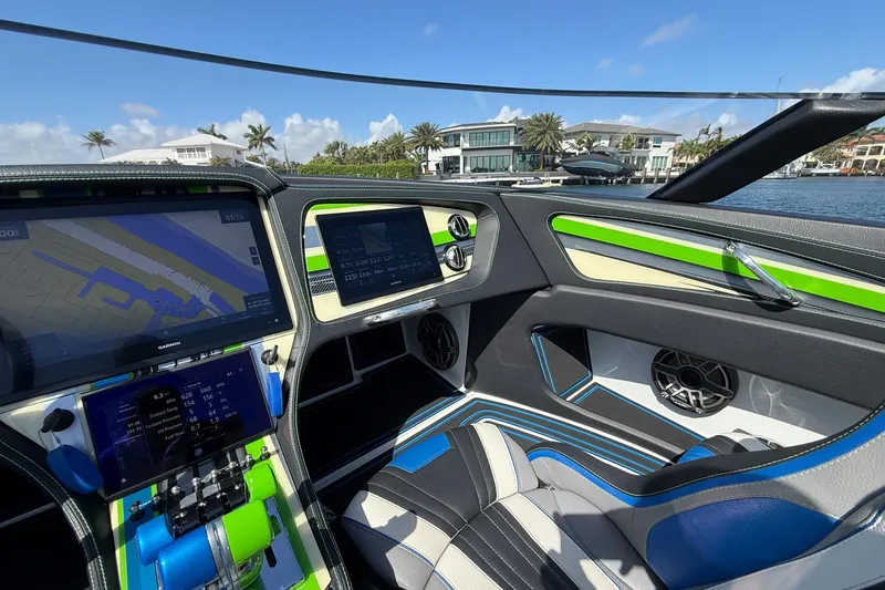 Slide: The Image of Interior of 2022 MTI 390X boat with advanced navigation displays and modern design. - 14