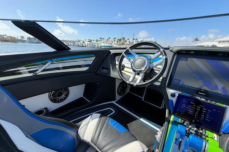 Slide: The Image of Interior of 2022 MTI 390X boat with modern steering and navigation system. - 15