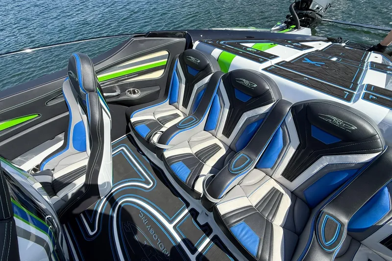 Slide: The Image of Luxury seating on 2022 MTI 390X boat with blue and green accents. - 17