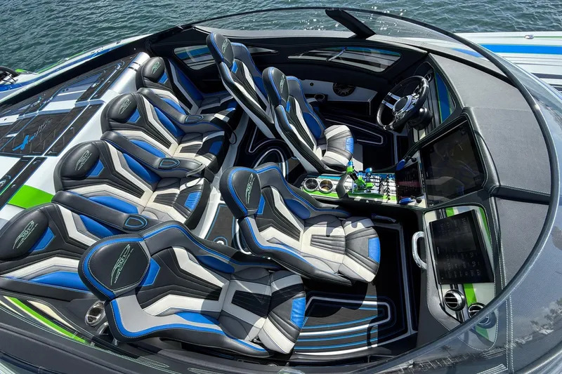 Slide: The Image of Luxury interior of 2022 MTI 390X boat with sleek, modern seating and advanced controls. - 19