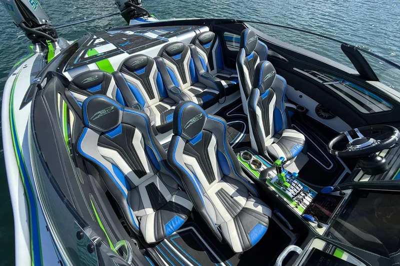 Slide: The Image of Luxury MTI 390X 2022 boat interior with stylish seating and modern controls on water. - 20