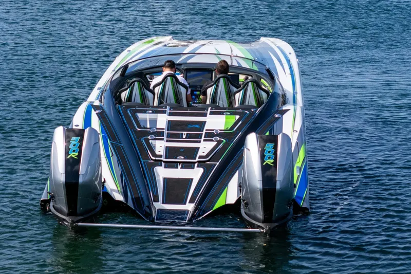 Slide: The Image of High-performance 2022 MTI 390X speedboat with dual 500R engines on water. - 26