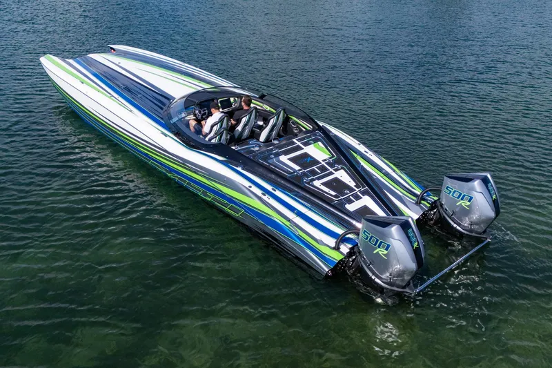 Slide: The Image of 2022 MTI 390X powerboat with dual engines on clear water. - 27