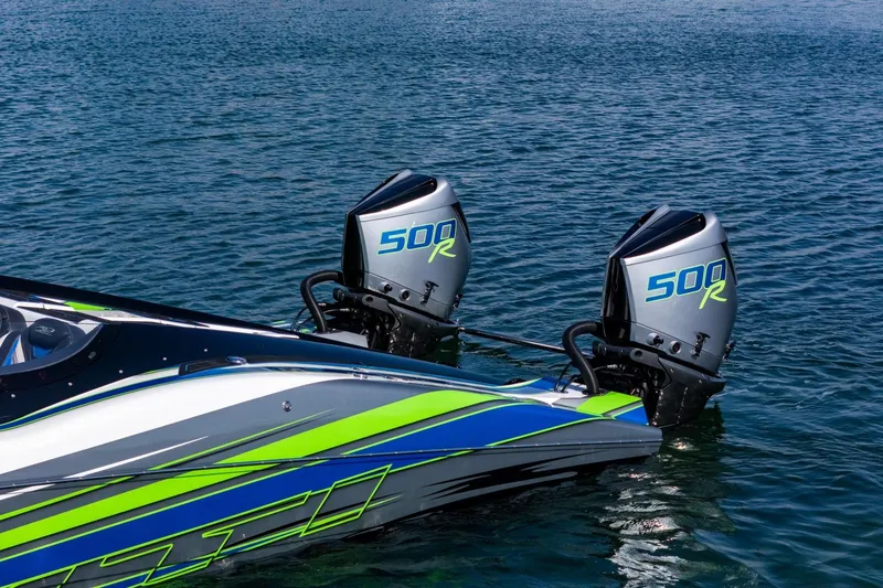 Slide: The Image of 2022 MTI 390X boat with dual 500R engines on water. - 31