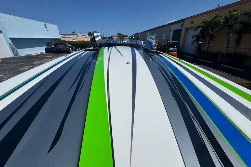 Slide: The Image of Colorful MTI 390X boat with sleek stripes, parked outdoors, 2022 model. - 47