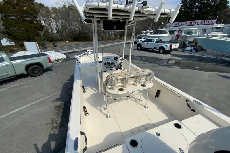 Slide: The Image of 2021 Carolina Skiff 21 LS boat at dealership, showcasing interior and seating arrangement. - 10