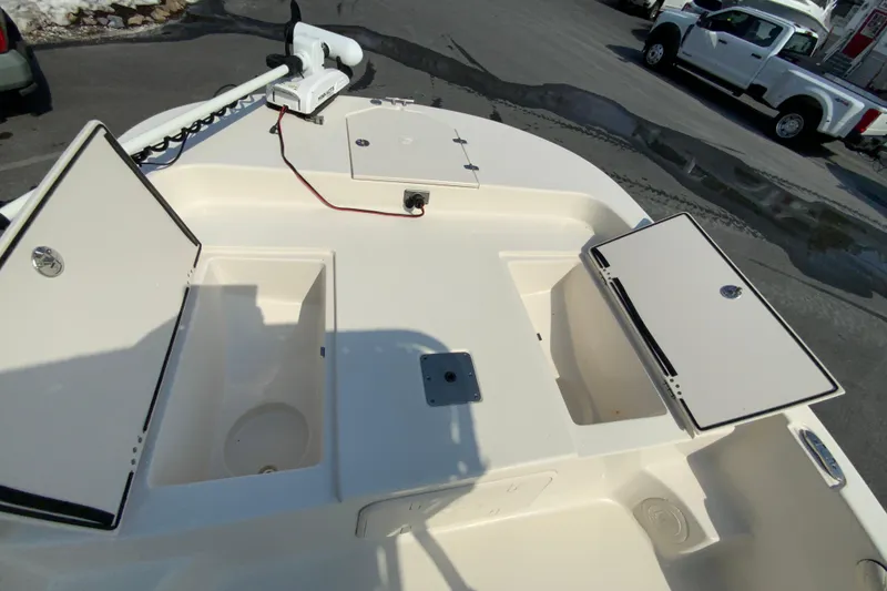 Slide: The Image of 2021 Carolina Skiff 21 LS boat deck with storage compartments open. - 14