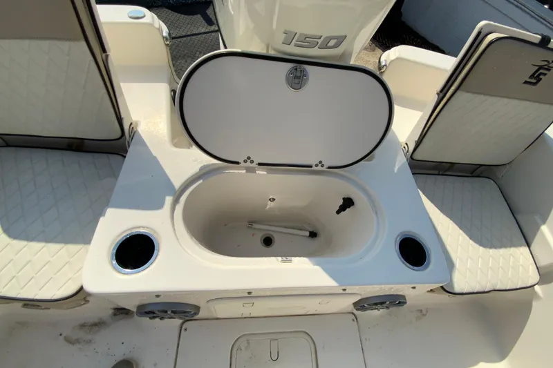 Slide: The Image of 2021 Carolina Skiff 21 LS boat interior with open storage compartment and seating. - 24
