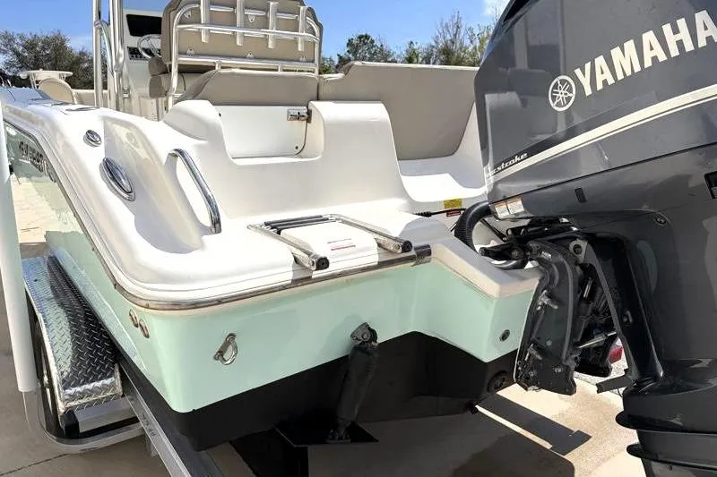 Slide: The Image of 2024 Key West 239 FS boat with Yamaha outboard motor, rear view. - 12