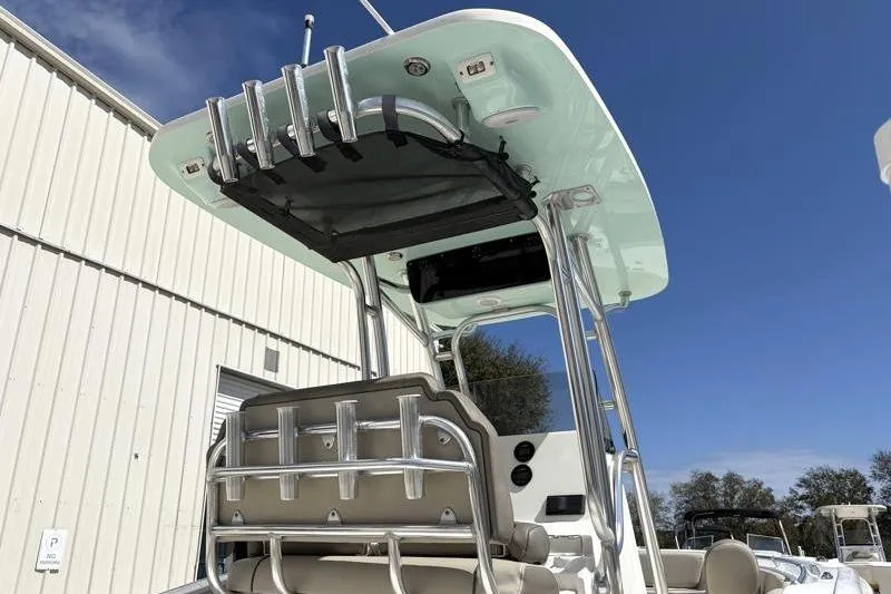 Slide: The Image of 2024 Key West 239 FS boat with T-top and rod holders, docked outdoors. - 15
