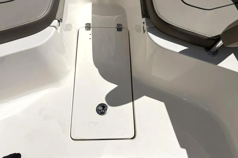 Slide: The Image of 2024 Key West 239 FS boat interior with storage compartment and seating. - 19