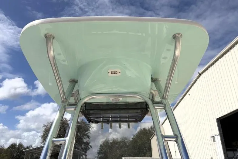 Slide: The Image of 2024 Key West 239 FS boat T-top against a cloudy sky background. - 21