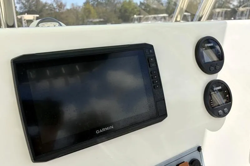 Slide: The Image of 2024 Key West 239 FS boat dashboard with Garmin and Yamaha displays. - 26